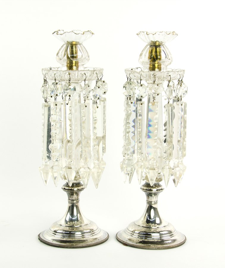 A PAIR OF CUT GLASS SINGLE-LIGHT CANDELABRA: A PAIR OF CUT GLASS SINGLE-LIGHT CANDELABRA 20th Century Each modeled with a crimped rim over a circular petal cut drip tray from which spear point prisms are hung, supported on a tapering standard ra