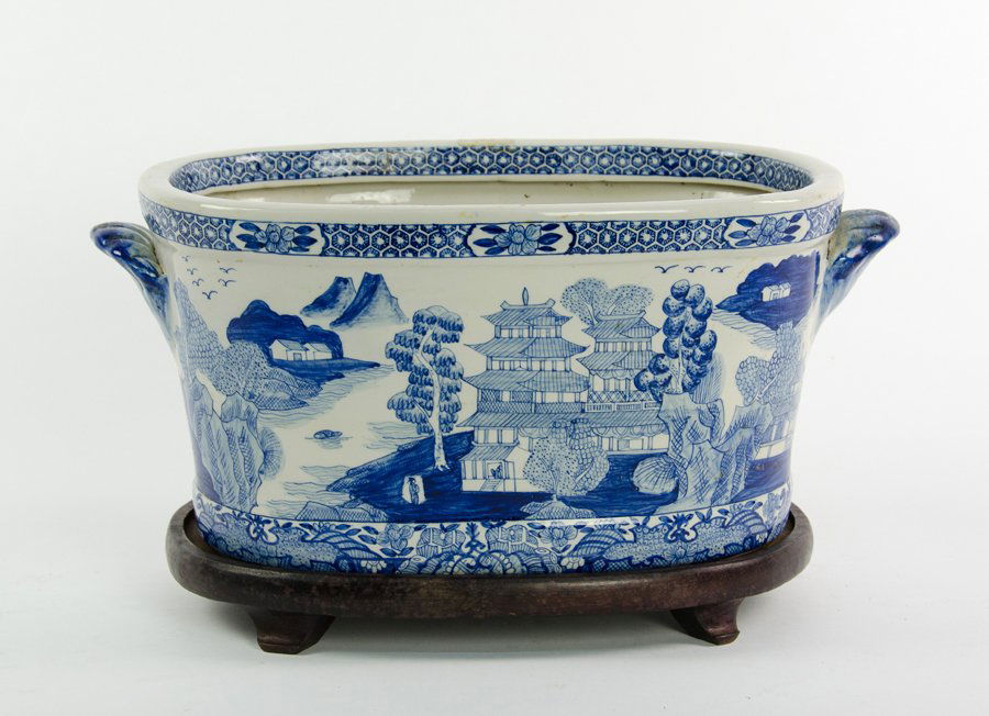 A BLUE AND WHITE PORCELAIN PLANTER ON HARDWOOD STAND (1 of 1)