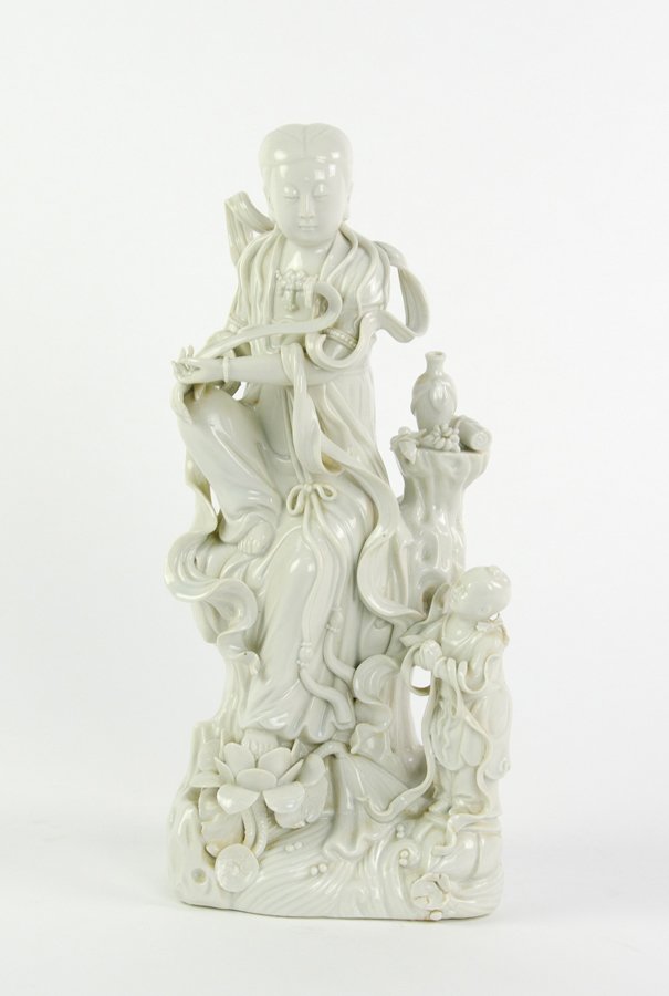 A CHINESE BLANC DE CHINE SLIP CAST FIGURE OF GUANYIN (1 of 2)