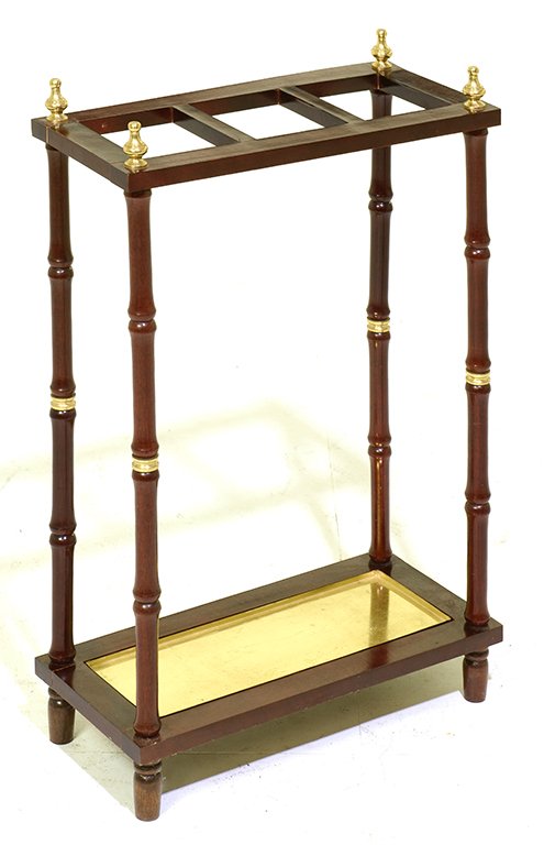 AN UMBRELLA STAND: AN UMBRELLA STAND The rectangular three section top on four turned bamboo style supports joined by a low lined drip tray. H 24½ x W 17¼ x D 8 inches