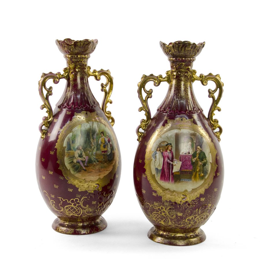A PAIR OF VICTORIA PORCELAIN FACTORY VASES: A PAIR OF VICTORIA PORCELAIN FACTORY VASES Altrohlau, Bohemia, Late 19th/early 20th century, circa 1891-1945 Each vase of flattened baluster form with applied gilt decorated handles, having a central