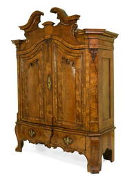 A LARGE NORTH GERMAN FIGURED WALNUT SCHRANK, POSSIBLY