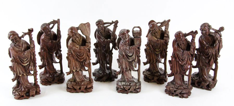 A GROUP OF EIGHT CHINESE STYLE CARVED HARDWOOD FIGURES (1 of 1)