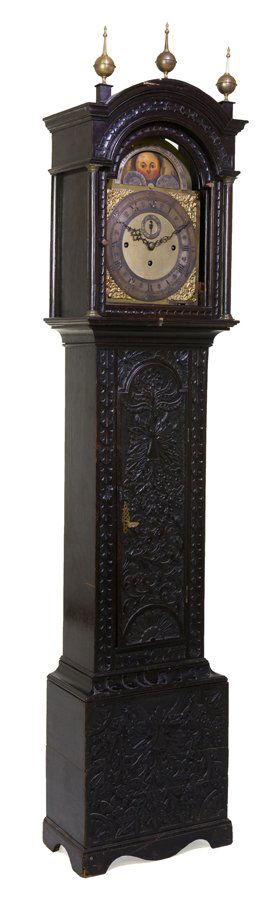 AN ENGLISH CARVED OAK TALL CASE CLOCK (1 of 3)