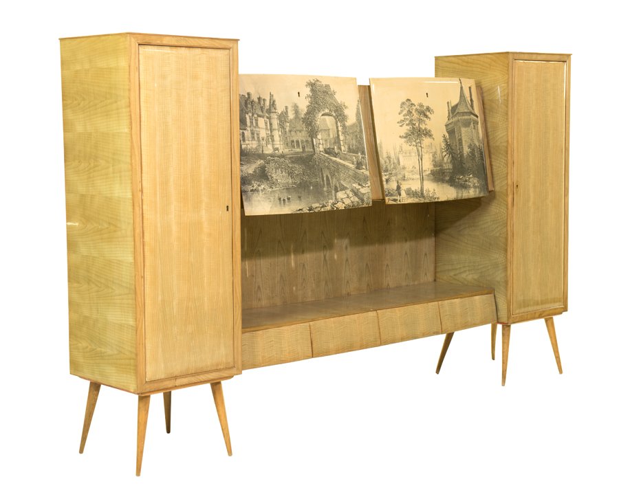AN ITALIAN MID-CENTURY MODERN CREDENZA: AN ITALIAN MID-CENTURY MODERN CREDENZA Circa 1950 The credenza having two paneled doors centered with two drop-down doors with transfer printed scenic decoration, opening to reveal a shelved interior,