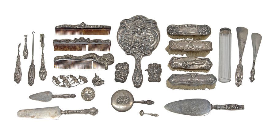 A COLLECTION OF STERLING SILVER ART NOUVEAU DRESSER: A COLLECTION OF STERLING SILVER ART NOUVEAU DRESSER ARTICLES Early 20th century Comprising a hand mirror, four clothes brushes, three combs with tortoiseshell teeth, a nail clipper, an octagonal glass