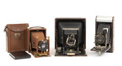 A GROUP OF THREE ANTIQUE CAMERAS