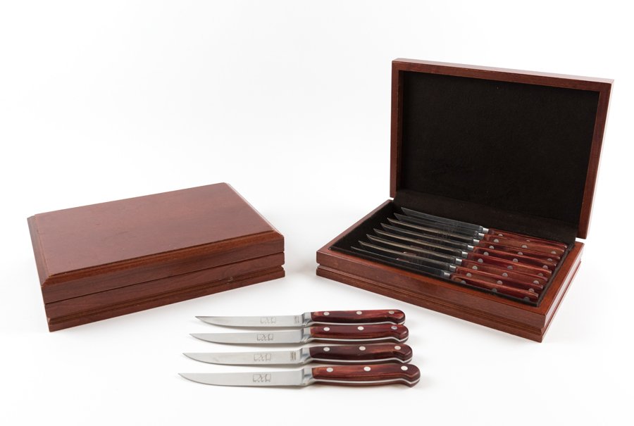 TWO SETS OF MARK'S AMERICAN CUISINE STEAK KNIVES IN: TWO SETS OF MARK'S AMERICAN CUISINE STEAK KNIVES IN CASE Each set containing eight knives within a fitted case. L of knife 8½ inches Provenance: Property from Mark's American Cuisine, Houston, TX