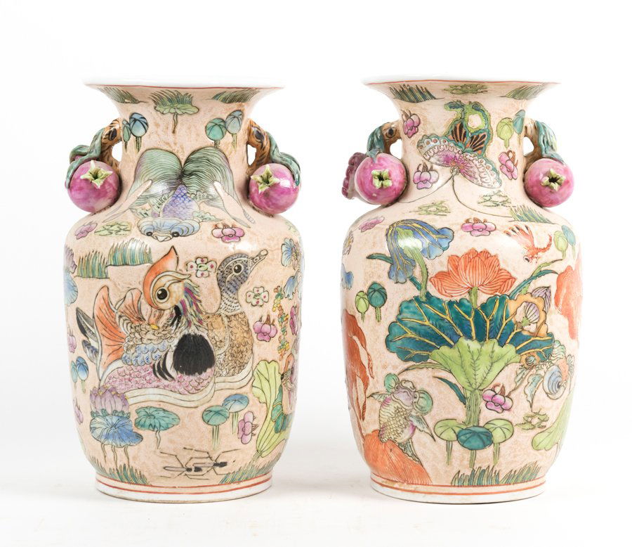 A PAIR OF CHINESE VASES: A PAIR OF CHINESE VASES Each of baluster form, with flared lip and applied pomegranate form handles to the neck, decorated with a panoramic fish, duck and butterfly design to the body, the base with a