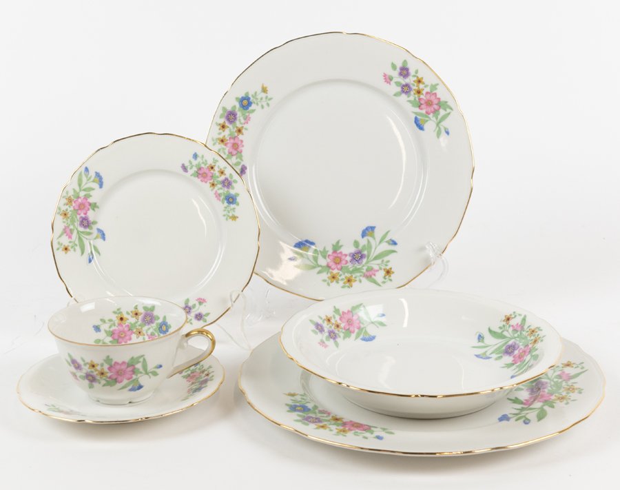 A FRENCH PORCELAIN PART-DINNER SERVICE: A FRENCH PORCELAIN PART-DINNER SERVICE Decorated with floral sprays on a white ground with gilt rim, comprising eleven dinner plates, twelve soup bowls, twelve salad plates, twelve side plates, ten sa