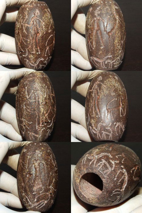 Wonderful Used Afghan Natural Intaglio Big Stone Bead: Wonderful Used Afghan Natural Intaglio Big Stone Bead , This bead is Carved Intaglio has a Hunter With many type of animals The size of it is 6 x 4 c m .