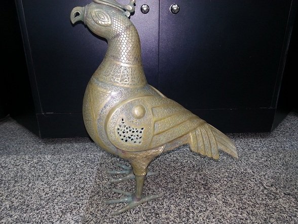Wonderful Islamic Persian Big Silver inlaid Bronze Bird: Wonderful Islamic Persian Big Silver inlaid Bronzs Bird all inlaid with islamic writing and picture , This bird Size is 14 x 14 x 6 " inches .