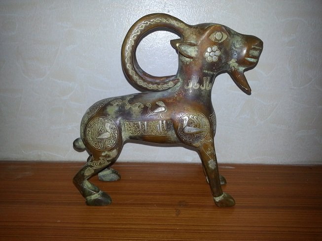 Lovely Islamic Style Silver Inlaid Bronze RAM @15: Lovely Islamic Style Silver Inlaid Bronze RAM @15 , The Bronze Ram have Silver Inlaid Islamic Calligraphic and Figures Birds all around . The Size is 1.9 kg Size is 8 1/2" 22cm