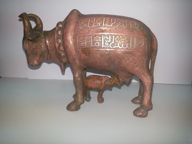 Islamic Style Bronze Silver inlaid Cow With Cattle @18: Wonderful unique Islamic Style Bronze Silver Inlaid Bronze Cow With Cattle All around working with Islamic Kufic Writings , the size is 6.5 x 6 " inches .