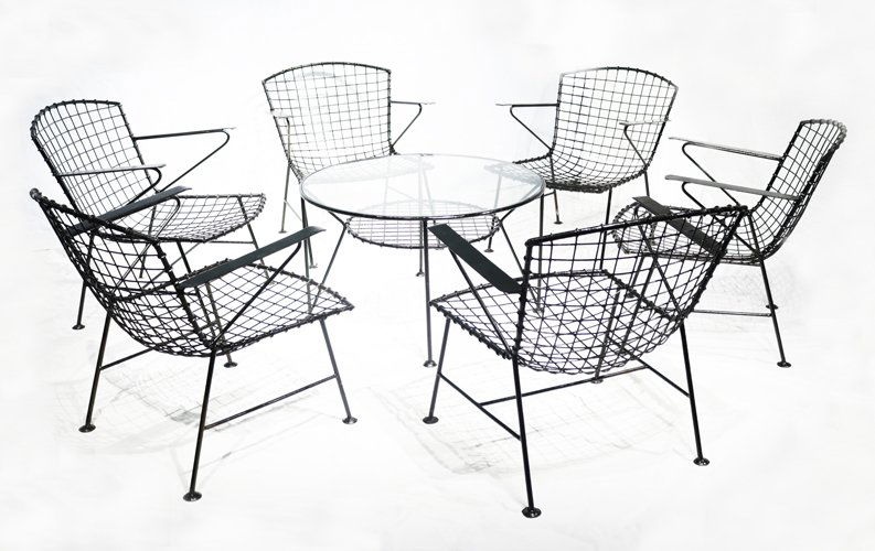 Wrought Iron Chairs and Table by Arte Español 2: 5 Chairs:H: 27” x L: 23 1/2” x W: 20” (69 cm x 60 cm x 51 cm)1 RoundTable:H: 18” x D: 31” (46 cm x 79 cm) Provenance:Dr. Alejandro Roces Legarda 