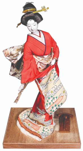 A Geisha Doll Kyugetsu Co., Ltd. Japan: ceramic 29” x 9” x 12” (74 cm x 23 cm x 30 cm)