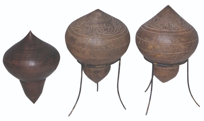 Three Maranao Tops: hardwood a) H: 8” (20 cm) D: 6” (15 cm) b) H: 10” (25 cm) D: 6 1/2” (17 cm) c) H: 10 1/2” (27 cm) D: 6 1/2” (17 cm)