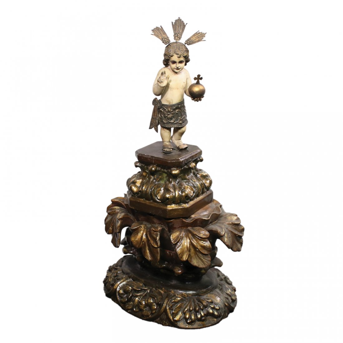 An Old Ivory Sto. Niño on a Wooden Peana with Virina: An Old Ivory Sto. Niño on a Wooden Peana with Virina Sto Niño: 8 1/2” x 3 1/2” x 2” (22 cm x 9 cm x 5 cm) Base: 11 1/2” x 10” x 9” (29 cm x 25 cm x 23