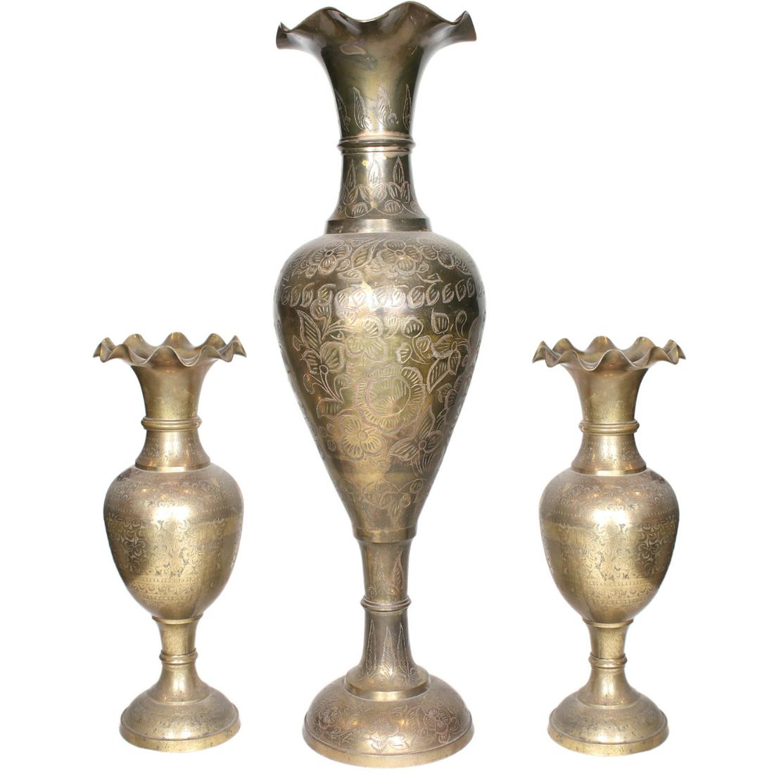 Three Brass Vases: Three Brass Vasesa) H: 29 1/2” (75 cm) D: 8 1/2” (22 cm) b) H: 17” (43 cm) D: 6 1/2” (17 cm) c) H: 17” (43 cm) D: 6 1/2” (17 cm)