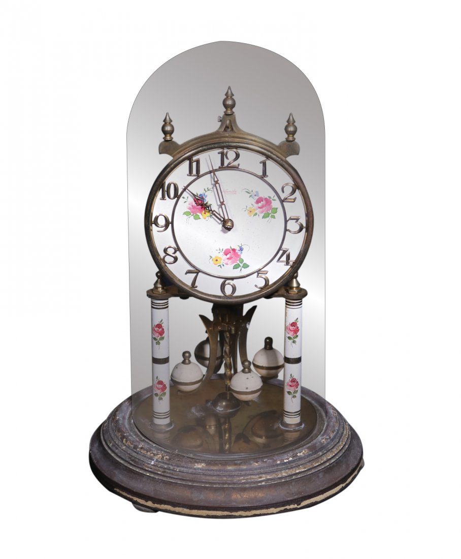 A Mantle Clock: A Mantle Clock 11 1/2” D: 8” (29 cm x 20 cm)