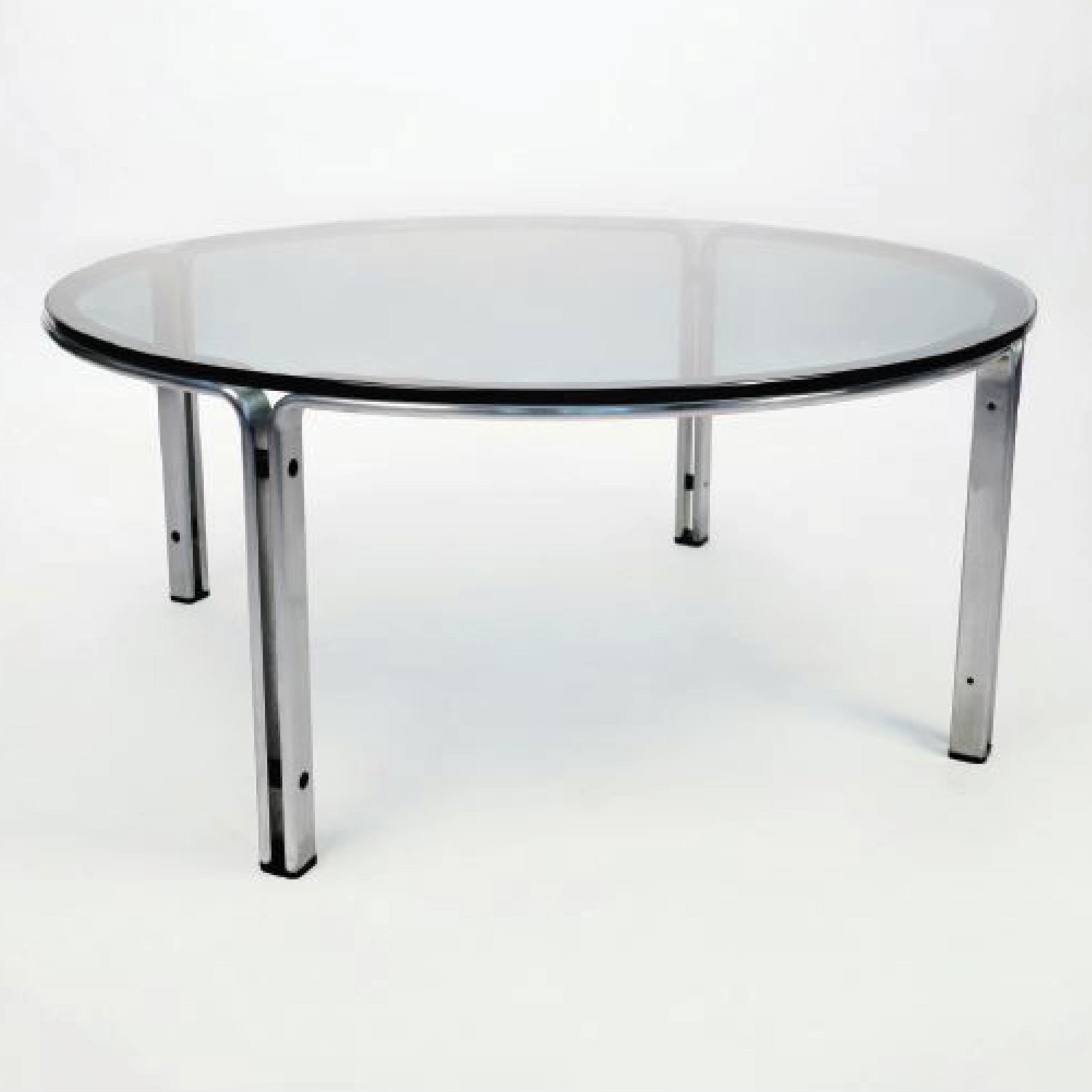 A Kill International Horst Bruning Cocktail Table, 1970: A Kill International Horst BruningCocktail Table, 1970 Vintage Smoked Glass and BrushedBent Steel Cocktail Table, made inGermany.Good Vintage ConditionHeight 15.75” Diameter 43.31”