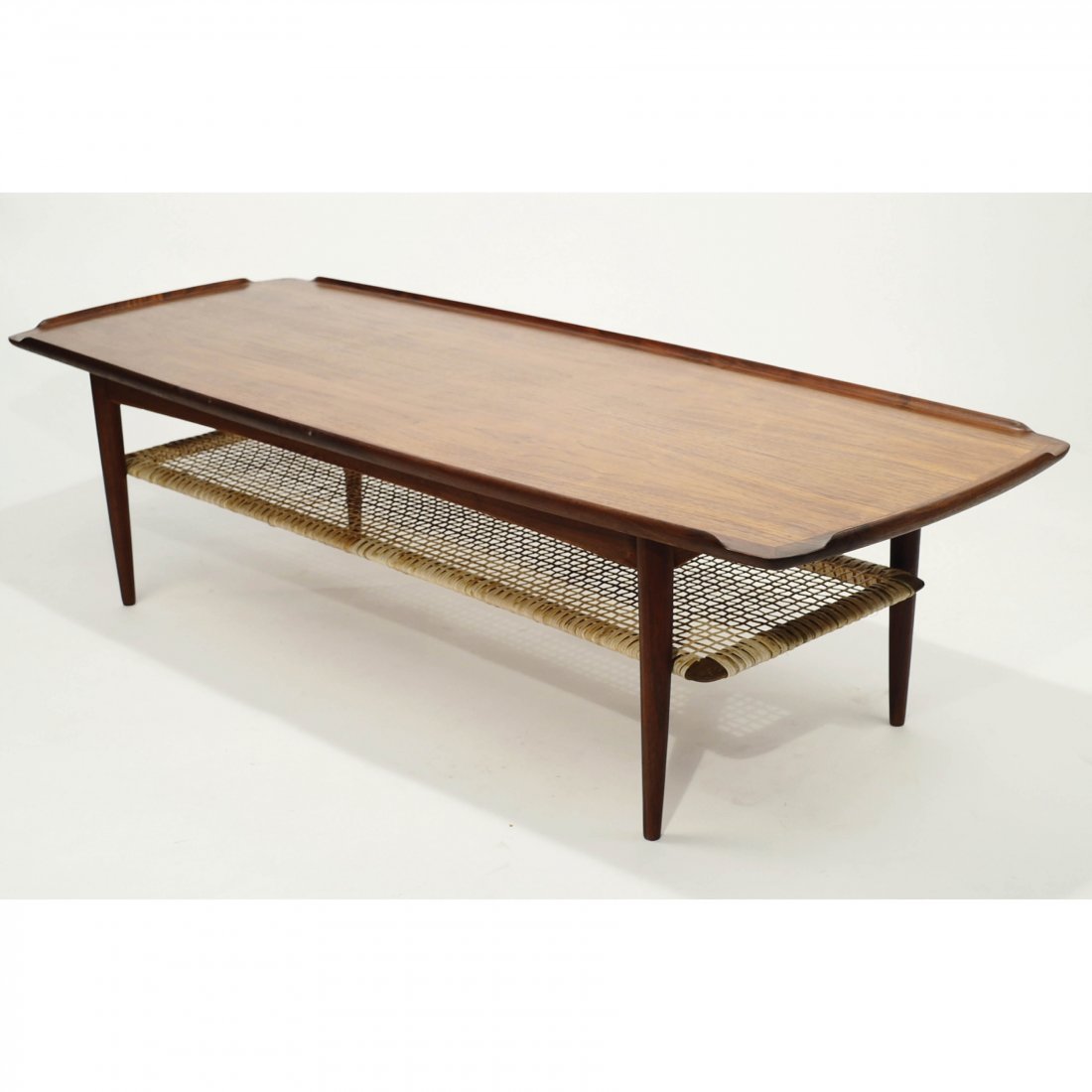 Danish Teak Coffee Table Poul Jensen for Selig: Danish Teak Coffee TablePoul Jensen for Selig Vintage Teak Wood Long Coffee TableDesigned by Poul Jensen for Selig,Denmark. Wicker 2nd tier in goodcondition. Dimensions H 15.5 L 58.5 D 22inches