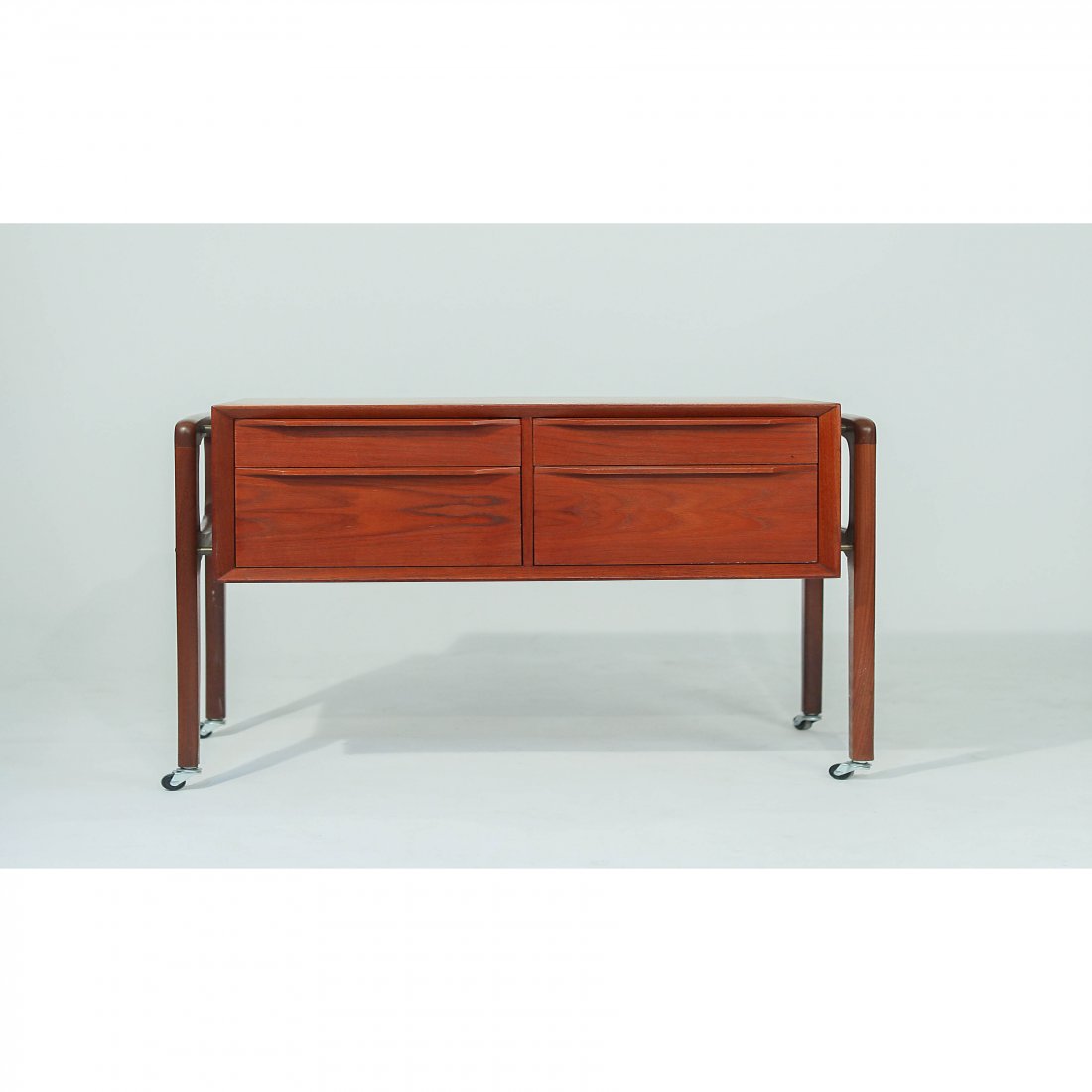Arne Vodder Teak Chest on Casters: Arne Vodder Teak Cheston Casters 1960s Teak Chest with 4 Drawers on aRolling Teak Frame. A very versatile pieceby Arne Vodder, Denmark. Dimensions H23.5 D 16.5 W 28 inches