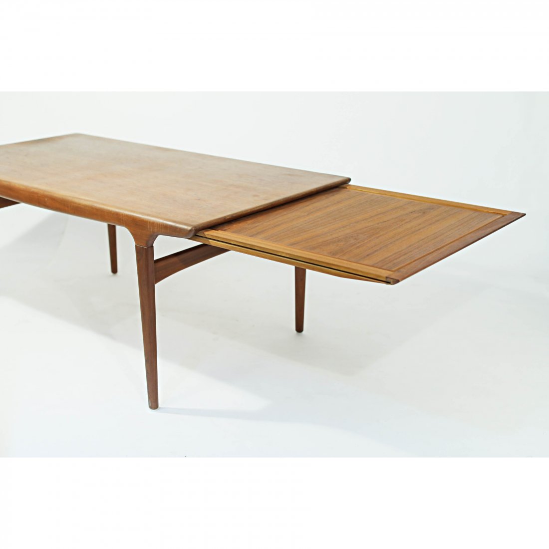 Niels MÃ¸ller Expanding Dining Table: Niels MÃ¸ller ExpandingDining Table 1950s Danish Teak Dining Tabledesigned by Niels Moller for JLMÃ¸llers, featuring a hiddenextending leaf that doubles asadded dining space or as a servingarea. D
