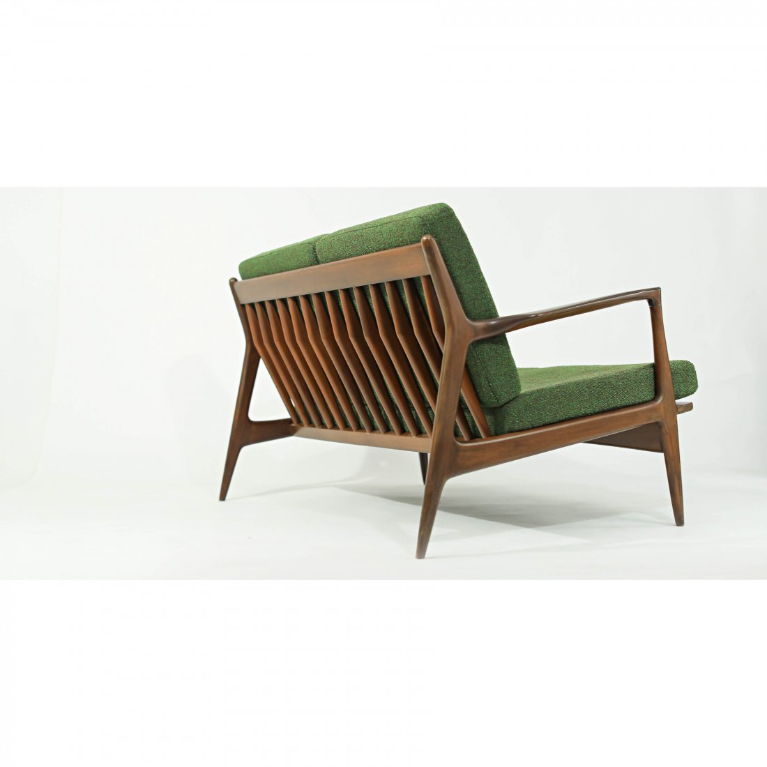 Ib Kofod Larsen Settee: Ib Kofod Larsen Settee Vintage 2 Seater Sofa designed by Ib Kofod Larsen for Selig,Denmark, circa 1960s. This iconic sofa features sculpturalarmrests and a beautiful slatted backrest. Dimensions H 28.