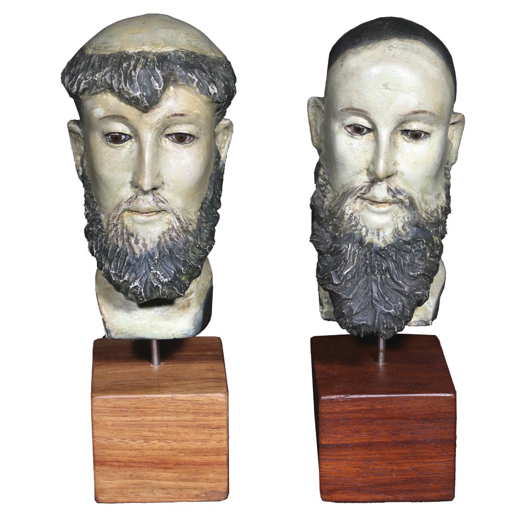 A Pair of Santo Busts Mounted on Hardwood Bases: A Pair of Santo Busts Mounted on Hardwood Bases 8 1/2” x 2 1/2” (22 cm x 6 cm)