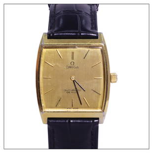 Omega: Model: De Ville Reference: 151.780 Case: — Year: 1970s Case Material: Gold Plated and Stainless Steel Case Diameter: 36 x 29mm Dial: Gold Dial With Black Markers and Hands Movement: Automatic