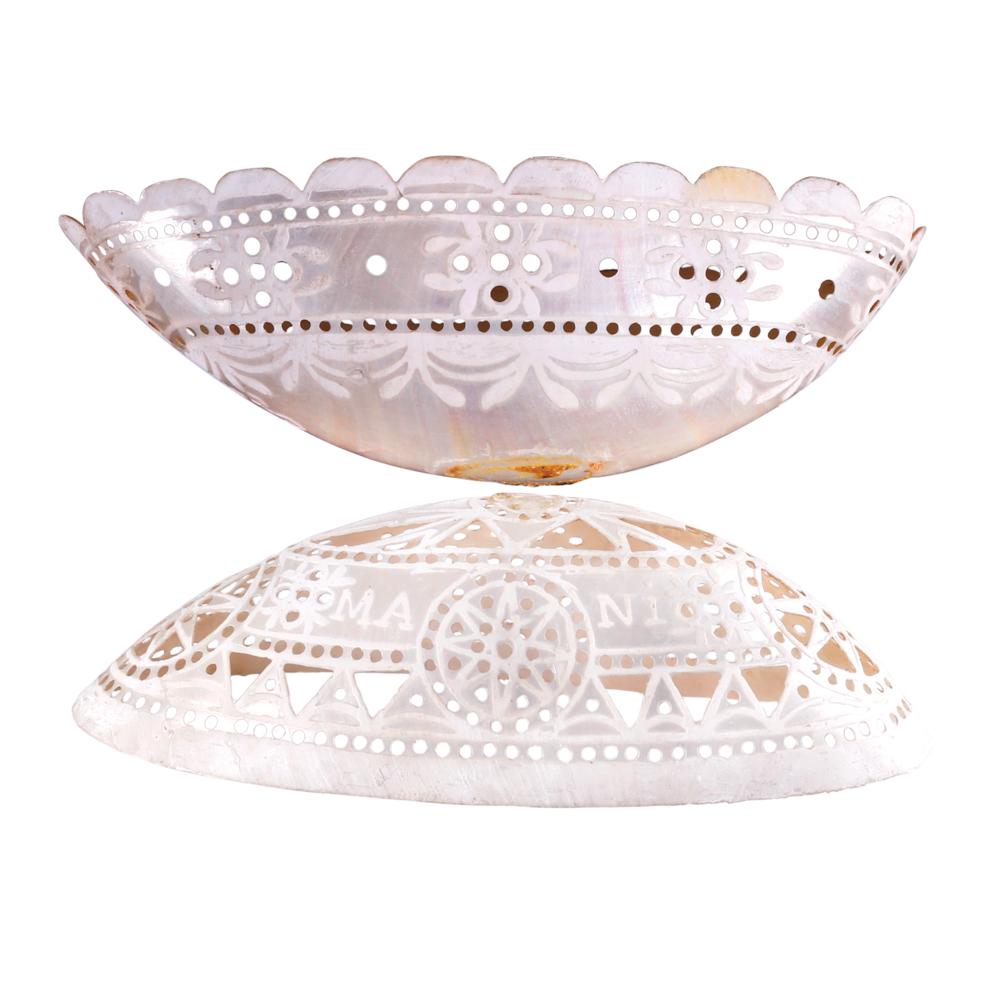 Eggâ€“Shaped Piercework Container Filipino: Eggâ€“Shaped Piercework ContainerFilipino 1880s nautilus shells, carved and polished a) 6 3/4" x 3 1/4" (17 cm x 8 cm), depth: 2" (5 cm)b) 6 1/2" x 3 1/4" (17 cm x 8 cm), depth: 2" (5 cm) PROVENA