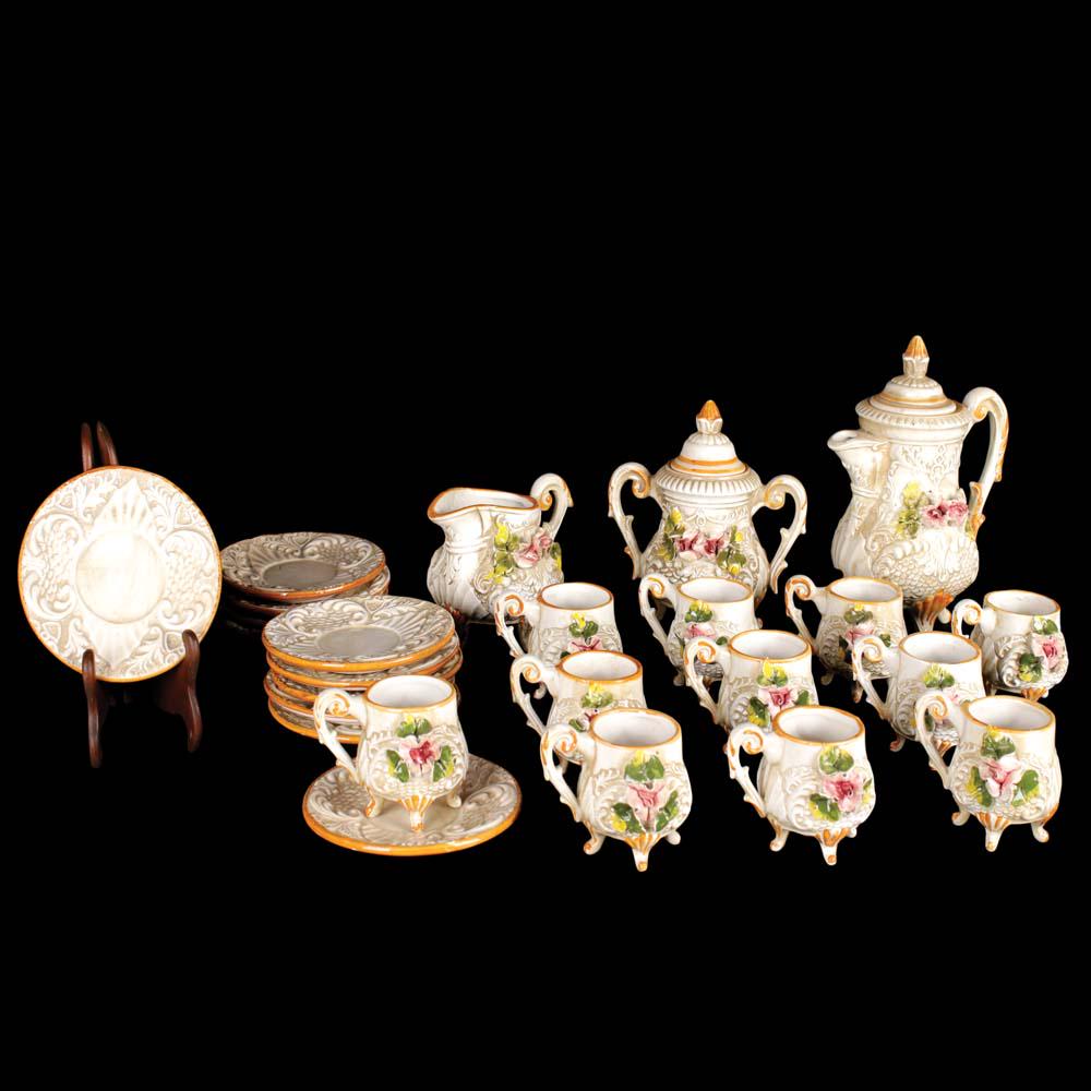 A 24-Piece Tea Service: 1 tea pot: 8” x 6 1/2” x 4” (20 cm x 17 cm x 10 cm)1 creamer: 4” x 5 1/2” x 3 1/2” (10 cm x 14 cm x 9 cm)1 sugar caddy: 6 1/2” x 6” x 4” (17 cm x