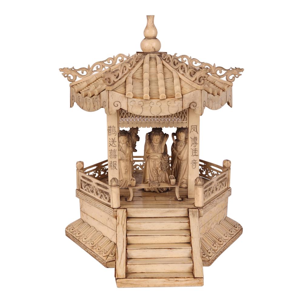 A Chinese Okimono: bone 14” x 12” x 11 3/4” (36 cm x 30 cm x 30 cm)