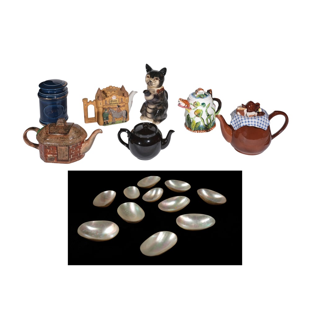 A Group Comprised of Six Tea Pots, a Tea Canister and Mother of Pearl Salt and Pepper Dishes ceramic: a. H: 7” (18 cm) D: 4 1/4” (11 cm)b. 5 1/2” x 8 1/2” x 4 1/2” (14 cm x 22 cm x 11 cm)c. 9 3/4” x 8” x 4 1/4” (25 cm x 20 cm x 11)d. 7 1/2” x 8&rdq