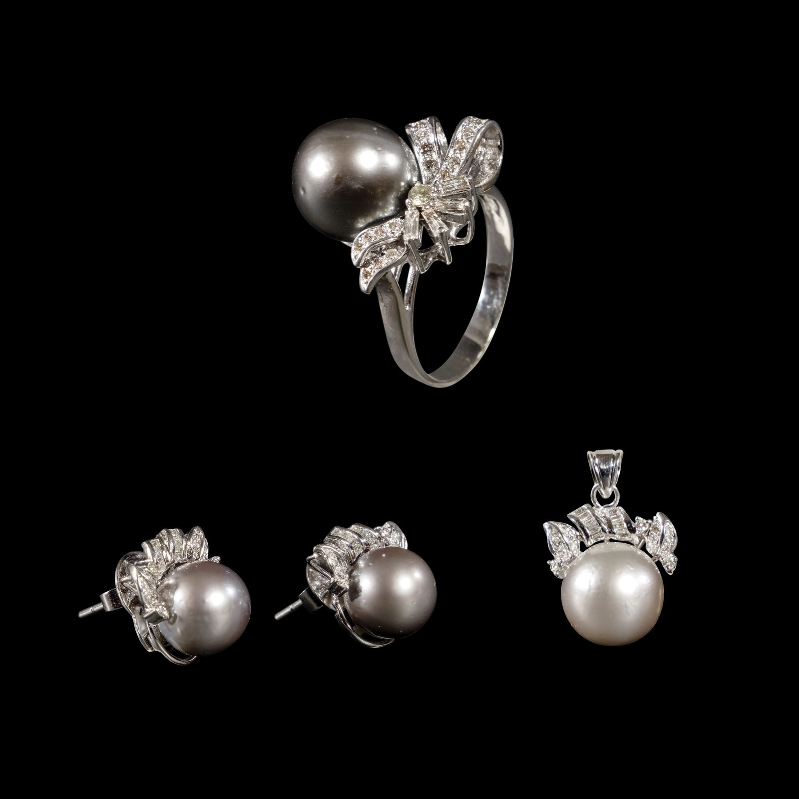 A Set of South Sea Pearl Jewelry: The set comprises of a pair of earrings, apendant and a ring, each centered by graySouth Sea Pearls accented by diamondsweighing approximately 0.93 cts. Weighs 12.20 grams, 5.80 grams and 7.20grams re