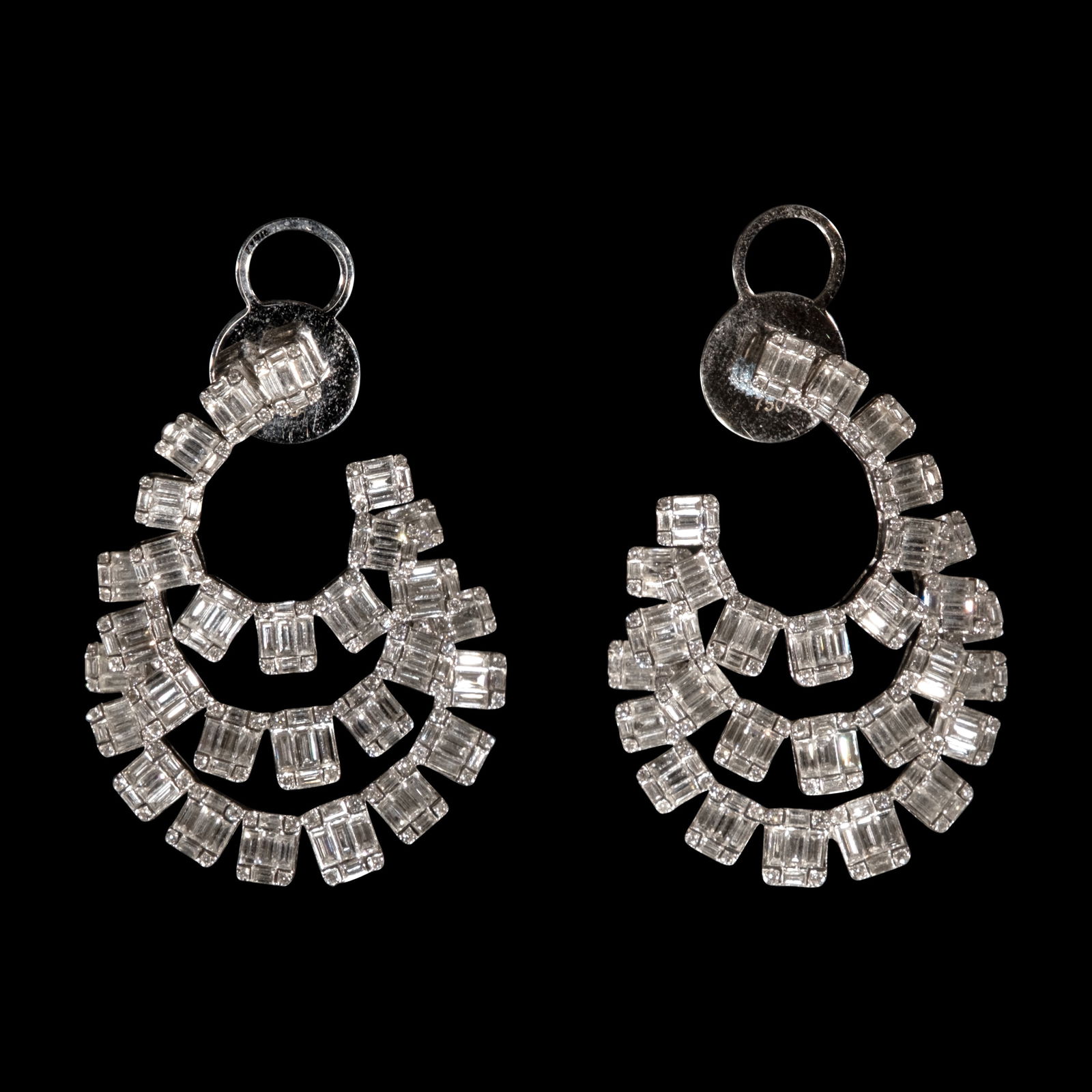 A Pair of Diamond Hoop Earrings in 18k: Set in 18k white gold, the three-layered hoopearrings feature illusion-set diamonds weighingapproximately 4.16 cts. Weighs 14.60 grams. Some stones noted as Refer on the GIAiD100®.