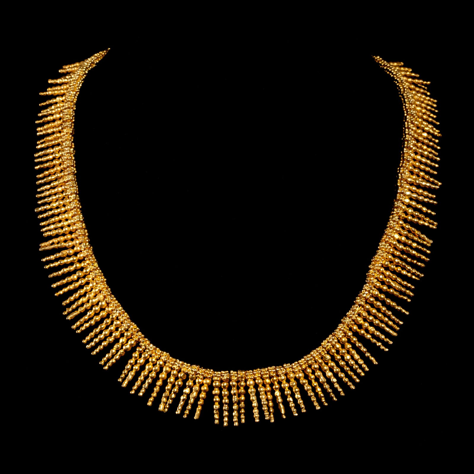 A Fringe Collier: The chic fringe collier features intricategranulation details. The piece is set in silverdipped in yellow gold. Weighs 71.30 g The necklace length is 16 inches.