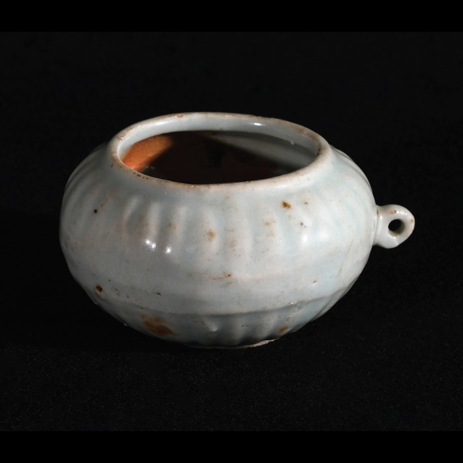 A Qing Dynasty Celadon Jarlet: H: 1 1/4” (3 cm)D: 2 1/2” (6 cm)