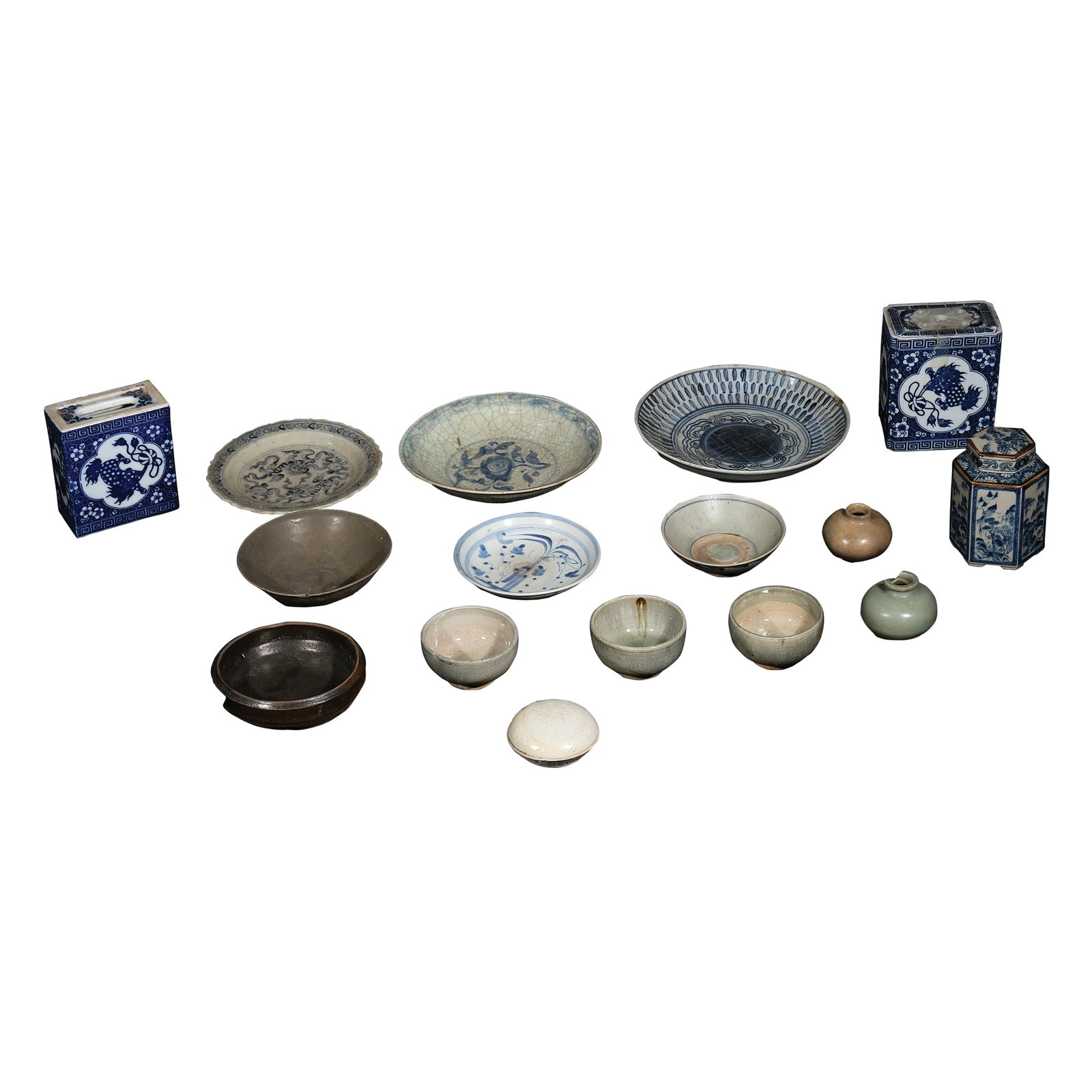 A Group of Sixteen Oriental Potteries: smallest:H: 1/2” (1 cm)D: 3 1/2” (9 cm) biggest:H: 6” (15 cm)L: 5 1/2” (14 cm)W: 3 1/2” (9 cm)