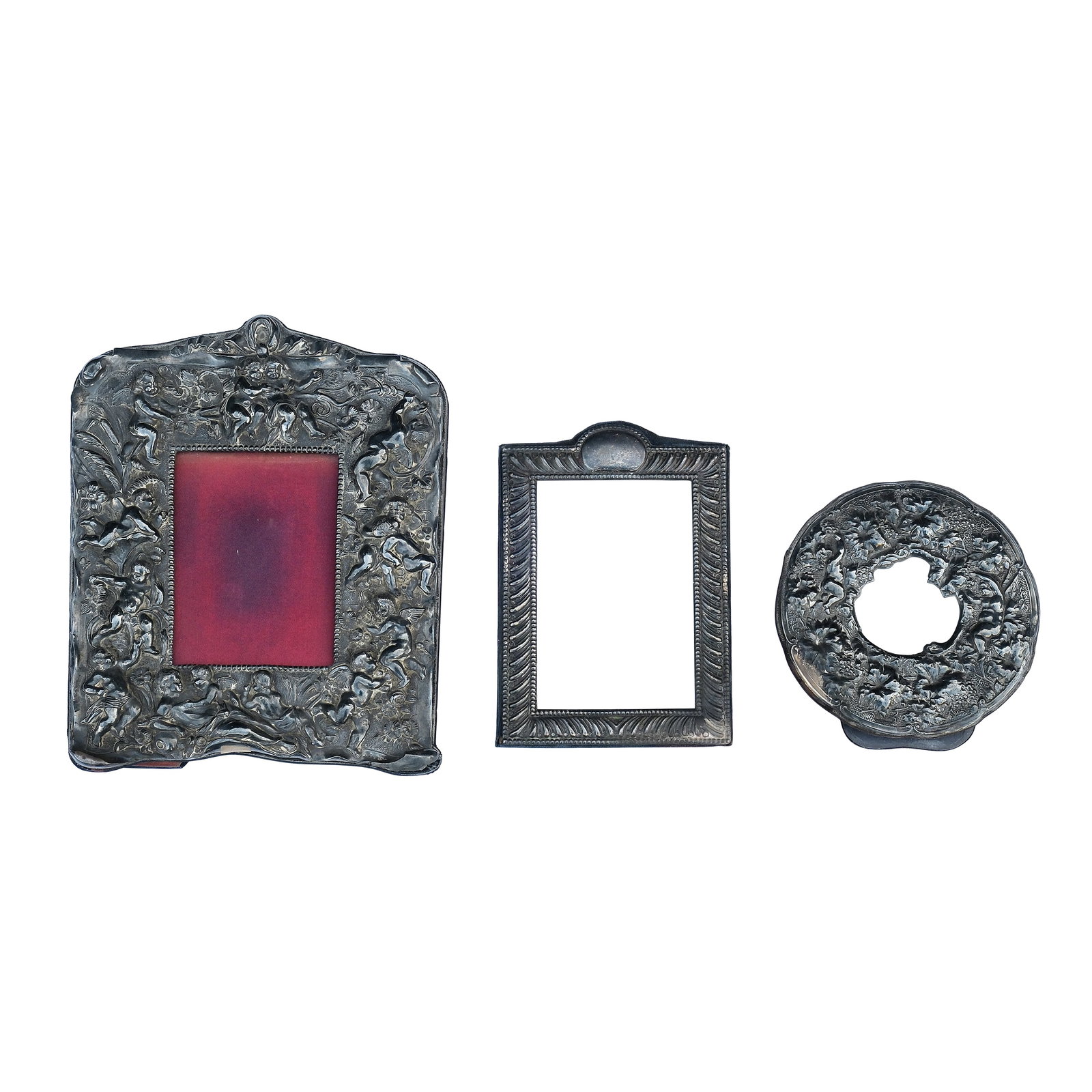 A Group Three Old Silver Frame: silvera.) H: 11” (28 cm)L: 3 1/2” (9 cm)b.) H: 8” (20 cm)L: 5 1/2” (14 cm)c.) D: 6 1/4” (16 cm) PROVENANCE:Johnny Ramirez Collection