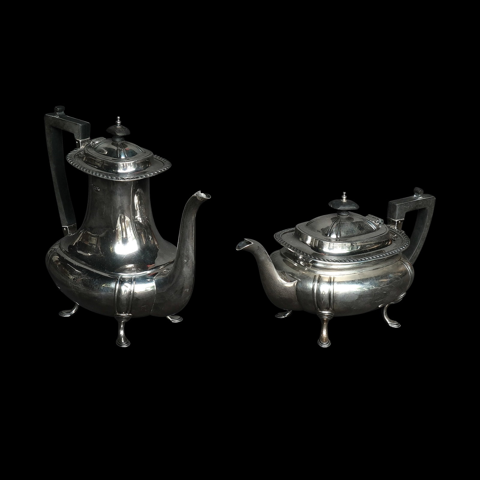 Two Ewers: silver a.) H: 5 1/2” (14 cm) L: 11 1/4” (29 cm) W: 5 1/4” (13 cm) b.) H: 8 3/4” (22 cm) L: 10” (25 cm) W: 5” (13 cm) total weight: 1004 grams