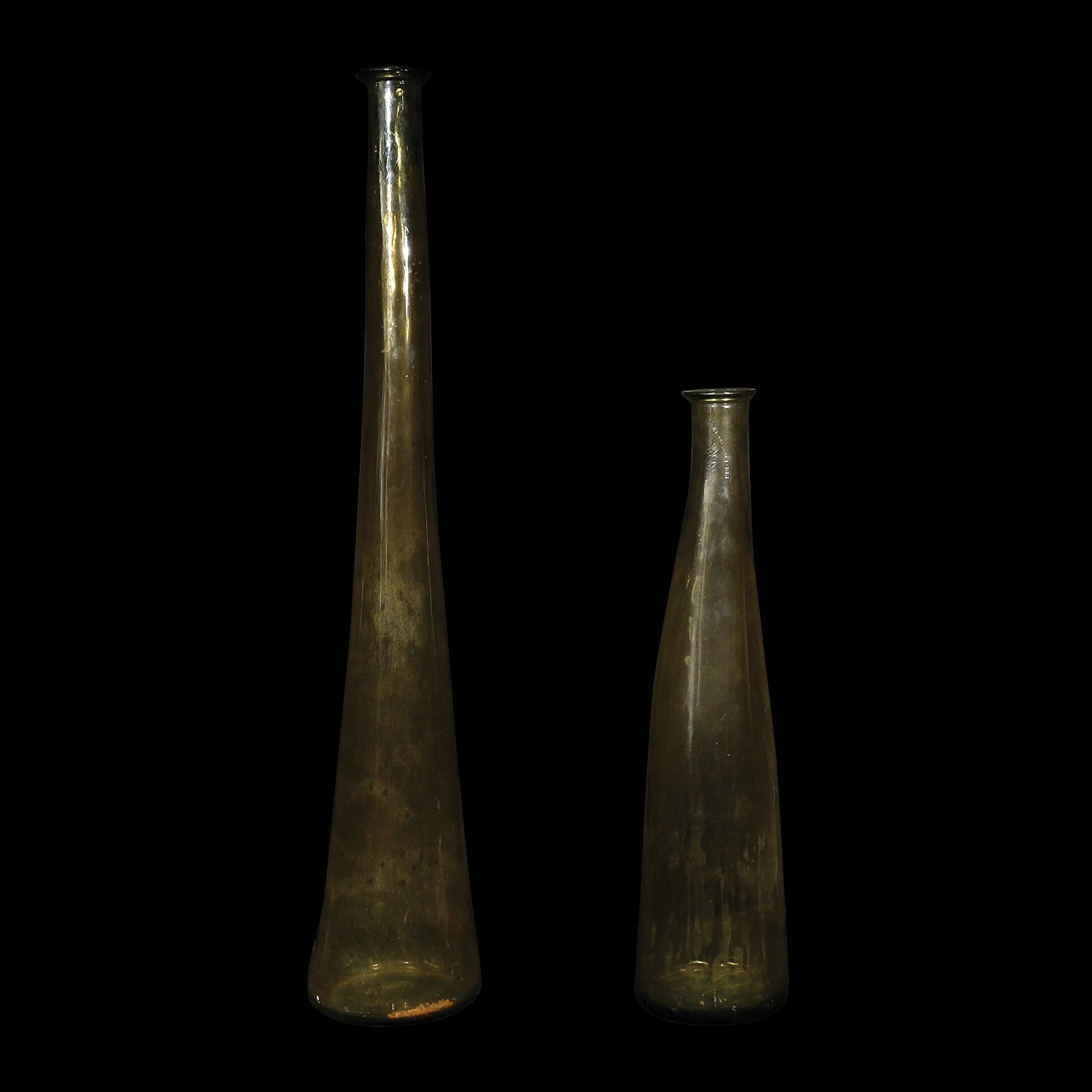 A Pair of Italian Glass Vases: a.) H: 46” (117 cm) D: 8” (20 cm) b.) H: 31” (79 cm) D: 7” (18 cm)