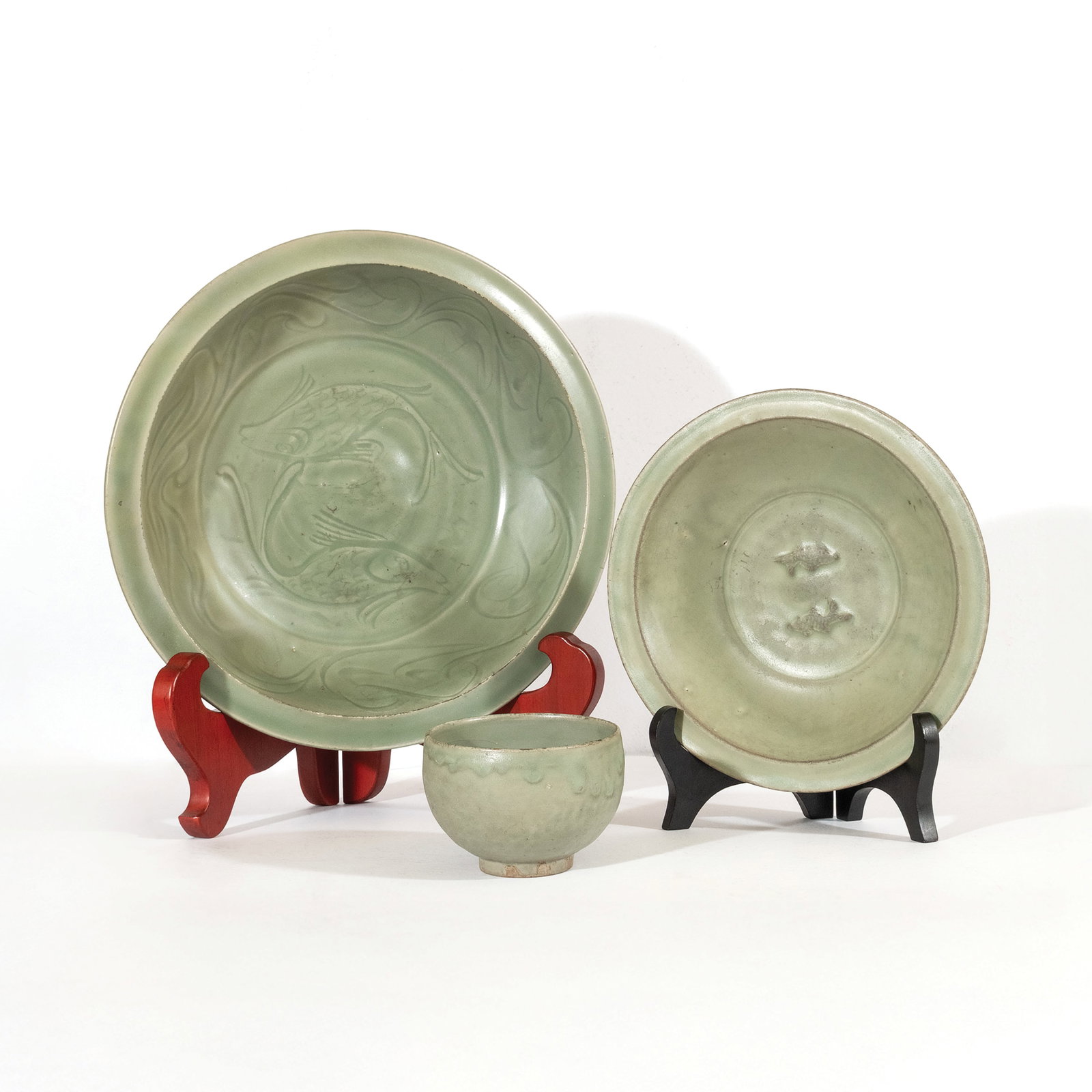 Three Longquan Celadon Wares: PROPERTY FROM THE MA. CRISTINA O. ROXAS COLLECTION Southern Song dynasty, 1127–1279 a.) large celadon plate diameter: 14" (36 cm) b.) small celadon plate diameter: 10 1/4" (26 cm) c.) celadon bowl