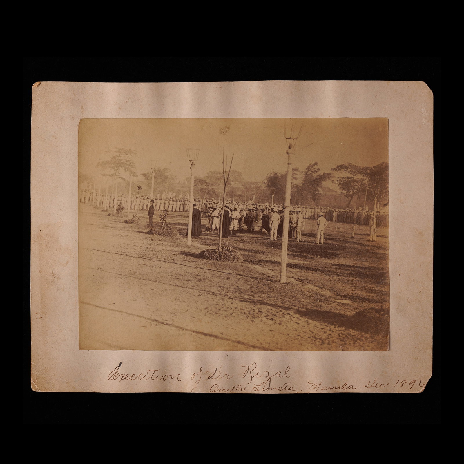 Manuel Arias y Rodr?guez (1850 - 1924): Execution of José Rizal Original Photograph : Albumen print photograph mounted on board: 8 3/4” x 11 1/4” (22 cm x 29 cm) image: 6 1/2” x 8 1/2” (17 cm x 22 cm) handwritten no