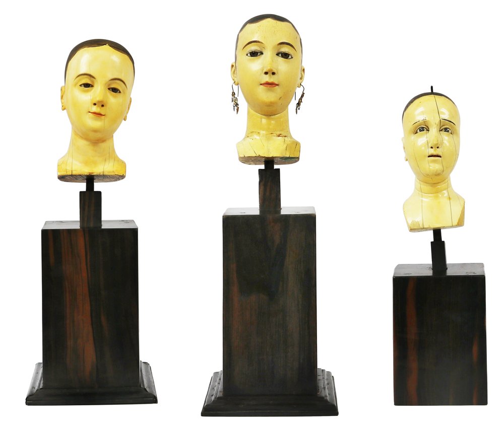 Ivory Heads (3 pcs.): a.) small: H:6 1/2” x L:3 1/4” x W:2 1/2” (17 cm x 8 cm x 6 cm)18th CenturyIvory and Glass b.) medium: H:6 3/4” x L:3” x W:2 1/4” (17 cm x 8 cm x 6 cm)Late 1