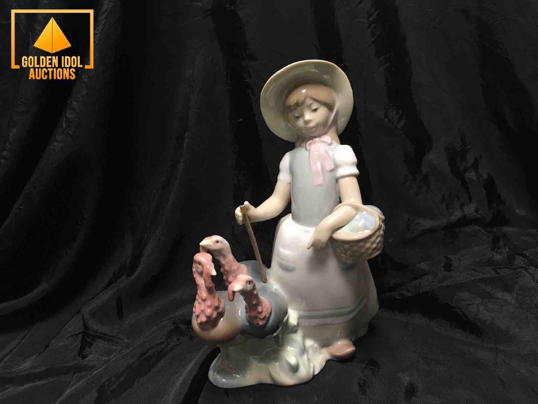 Lladro figurine of girl porcelain with three turkeys. (1 of 3)