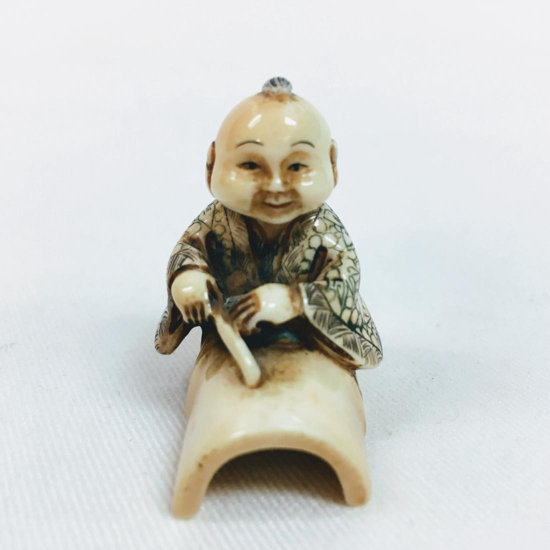 19th Century Netsuke man on and under trunk figure (1 of 6)