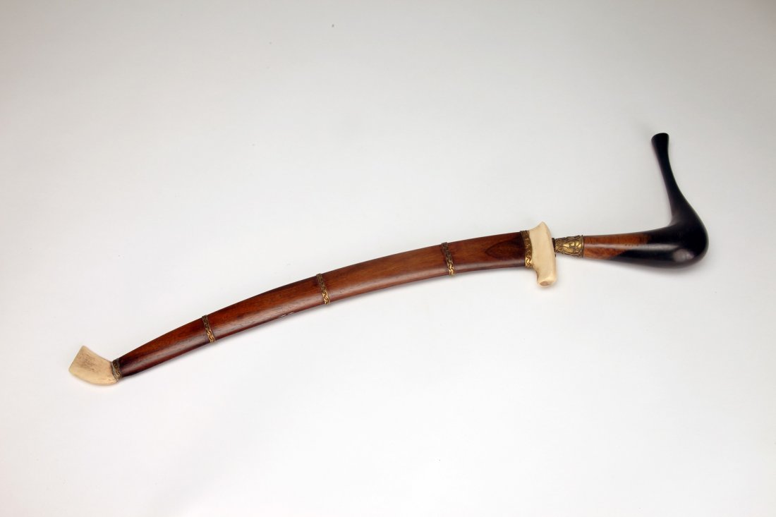 Aceh Rencong Knife: Aceh, Indonesia, c. early 20th century; The blade with much gold tone metal inlay. The wood and bone scabbard with gold metal bands. Length of knife without scabbard: 17 3/4" (45cm)