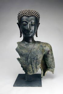 Rare Life-size Thai Bronze Bust of Buddha: Northern Thailand, c. 15th century; A fine fragmentary figure in Ayutthaya style, custom mount. Height, without stand, 26" (66cm) Ex Milton Fox Collection. Mr. Fox (1904-1971) was editor at Harry N. A